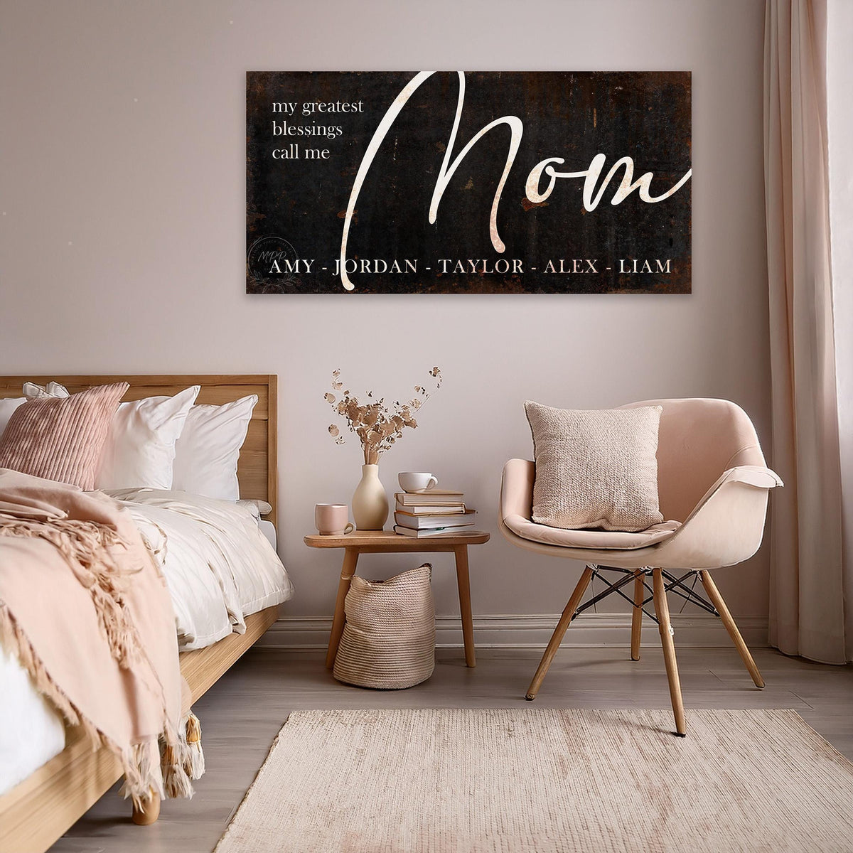 May include: A black and white sign with the word "Mom" in a cursive font. The sign also includes the text "My greatest blessings call me" and a list of names: Amy, Jordan, Taylor, Alex, Liam.