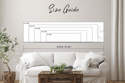 a living room with a white sofa and a wooden coffee table. Above the sofa, there is a size guide that provides dimensions for the different sizes of the sofa.