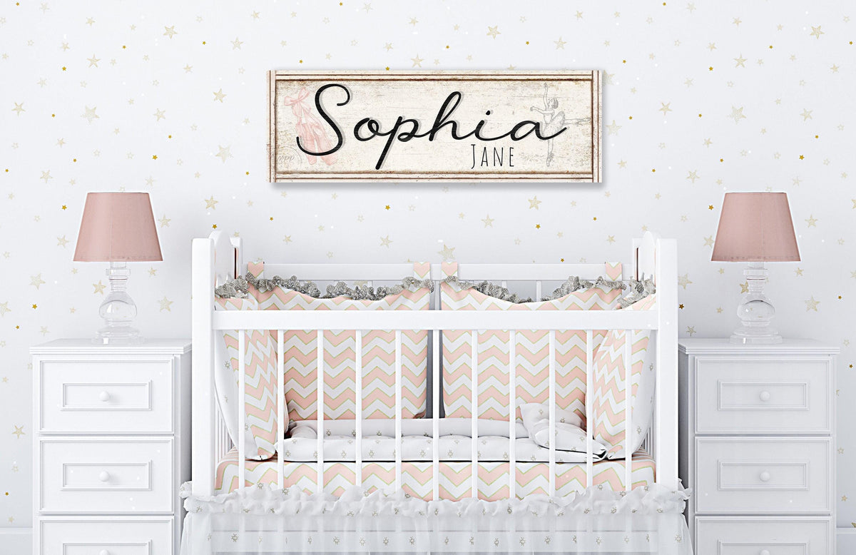 Nursery Name Sign Girl Baby Name Sign For Nursery Wall Art Girl Modern Farmhouse Wall Decor Custom Personalized Girl Name Sign Large Wall Art.  Black lettering with graphic of ballerina and ballet slippers over faux distressed wood frame on canvas.