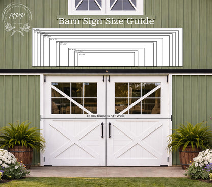 a white barn with a large barn sign above the door, providing a guide for the size of the sign. The barn has a green exterior and is surrounded by potted plants.